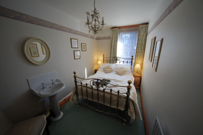 Our new bed in the double room that has private use of a luxury bathroom.