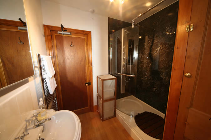 Now this is a luxury bathroom - with walk in shower and vertical shower tower.
